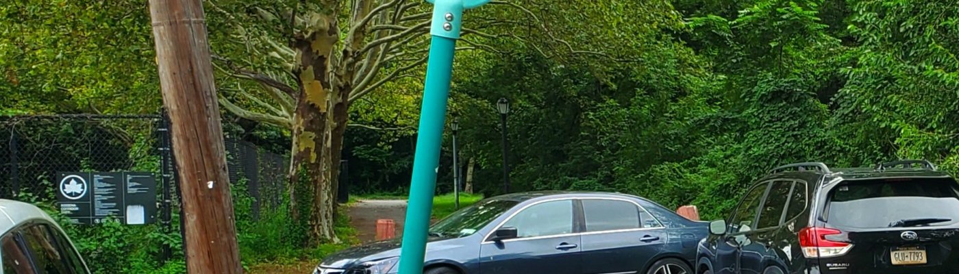 Two cars blocking the greenway since their owners (playing soccer) didn't feel like using the available legal parking spaces a few dozen feet away.